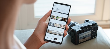 Photo of a woman looking at a photos transferred from the camera