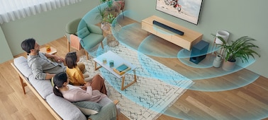 A family in a living room watching TV – blue sound waves are emanating from the soundbar and subwoofer